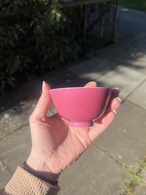 Lot 574 - A small pink monochrome bowl