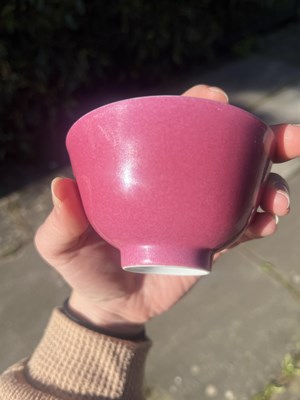 Lot 574 - A small pink monochrome bowl