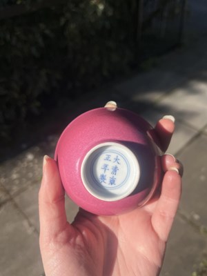 Lot 574 - A small pink monochrome bowl