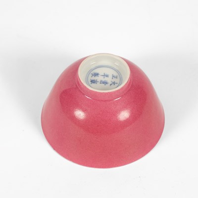 Lot 574 - A small pink monochrome bowl