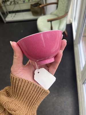Lot 574 - A small pink monochrome bowl