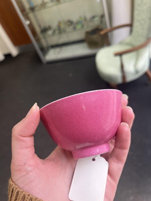 Lot 574 - A small pink monochrome bowl