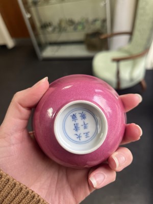 Lot 574 - A small pink monochrome bowl