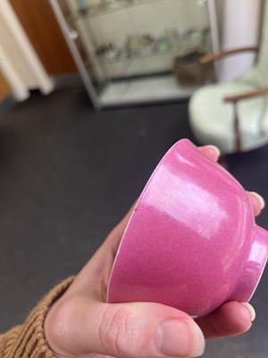 Lot 574 - A small pink monochrome bowl