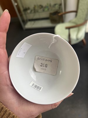 Lot 574 - A small pink monochrome bowl