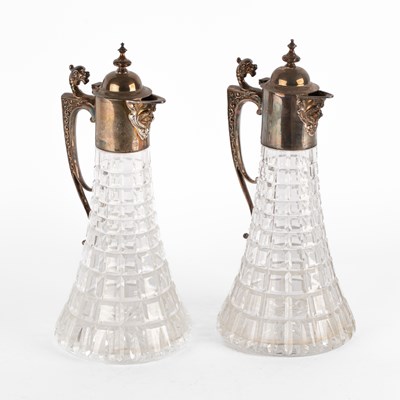 Lot 51 - A pair of silver mounted claret jugs