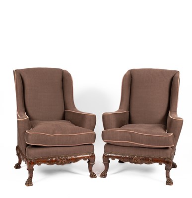 Lot 253 - A pair of George I style wing armchairs