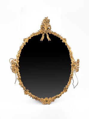 Lot 344 - An oval brass framed girandole