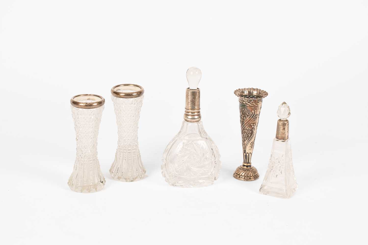 Lot 23 - Two glass scent bottles with silver collars