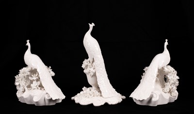 Lot 541 - Two Coalport white glazed peacocks
