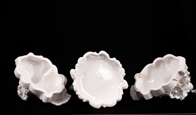 Lot 541 - Two Coalport white glazed peacocks