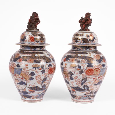 Lot 556 - A pair of Imari baluster vases and covers