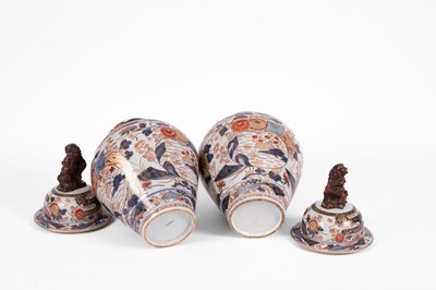 Lot 556 - A pair of Imari baluster vases and covers