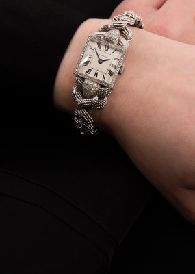 Lot 180 - A lady's white gold and diamond set cocktail watch