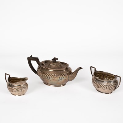 Lot 60 - An Edwardian bachelor's three-piece silver tea set
