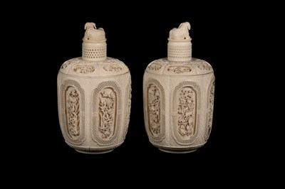 Lot 465 - A pair of Chinese carved ivory jars and covers