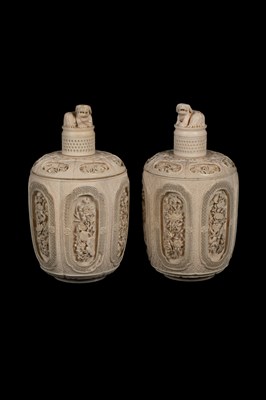 Lot 465 - A pair of Chinese carved ivory jars and covers