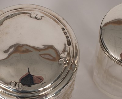Lot 27 - A quantity of silver topped glass dressing table bottles