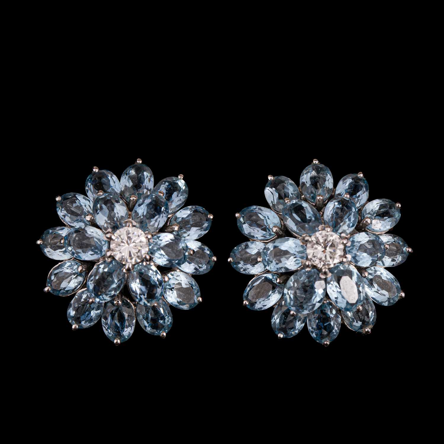 Lot 146 - A pair of mid Century blue topaz and diamond cluster earrings