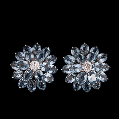 Lot 146 - A pair of mid Century blue topaz and diamond cluster earrings