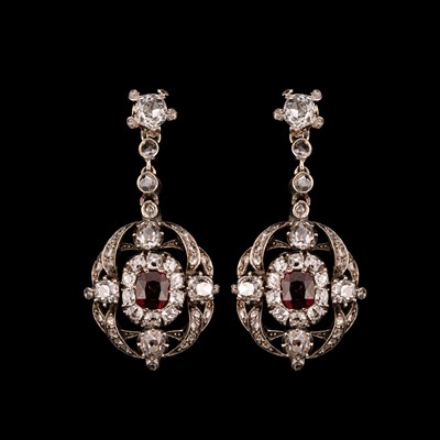 Lot 111 - A pair of Edwardian ruby and diamond drop earrings