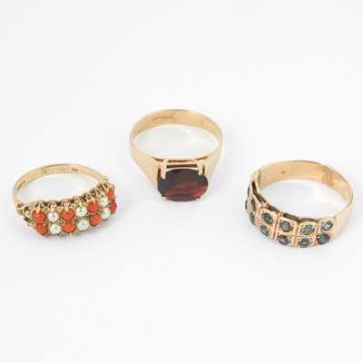 Lot 115 - Three yellow metal gem set dress rings