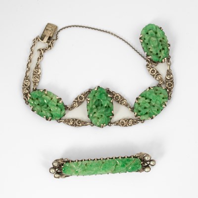 Lot 142 - A jade set bracelet and brooch