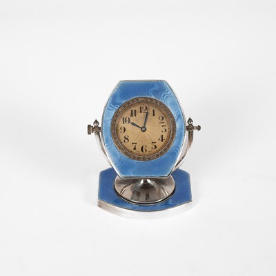 Lot 15 - An Art Deco silver and enamel table clock
