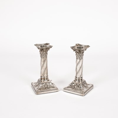 Lot 10 - A pair of Victorian silver mounted candlesticks