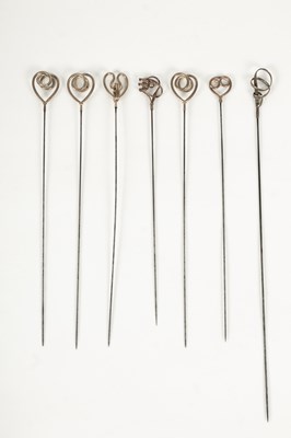 Lot 25 - An Edwardian Art Nouveau gold plated and brass hatpin