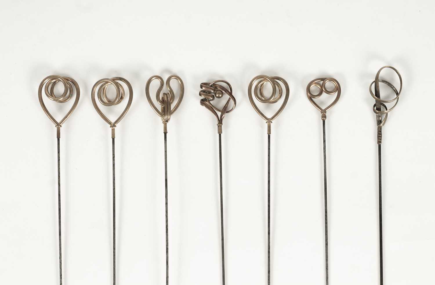 Lot 25 - An Edwardian Art Nouveau gold plated and brass hatpin