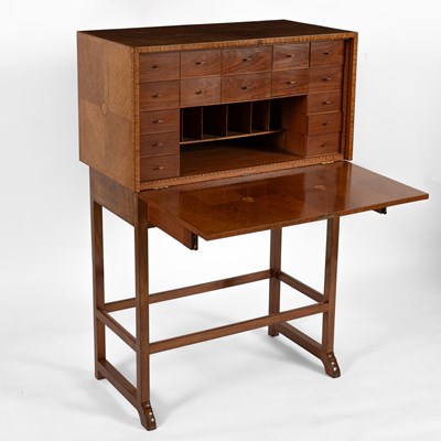 Lot 124 - Ernest Gimson (1864-1919) A writing cabinet on stand