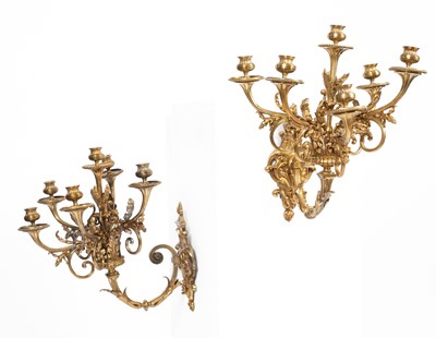 Lot 545 - A pair of gilt brass six light wall sconces