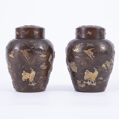 Lot 852 - A pair of Japanese mixed metal jars and covers