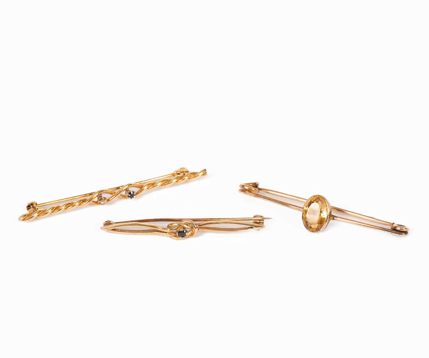 Lot 7 - Three yellow metal gem set bar brooches