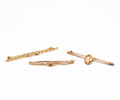 Lot 7 - Three yellow metal gem set bar brooches