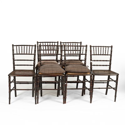 Lot 163 - A set of six Regency style black painted faux bamboo chairs