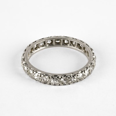 Lot 266 - An early 20th Century white metal and diamond eternity ring