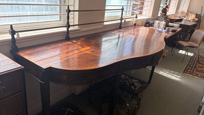 Lot 371 - A George III mahogany serving table of serpentine outline