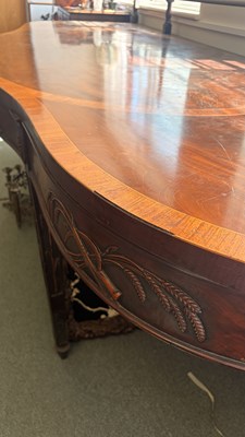 Lot 371 - A George III mahogany serving table of serpentine outline