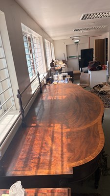 Lot 371 - A George III mahogany serving table of serpentine outline