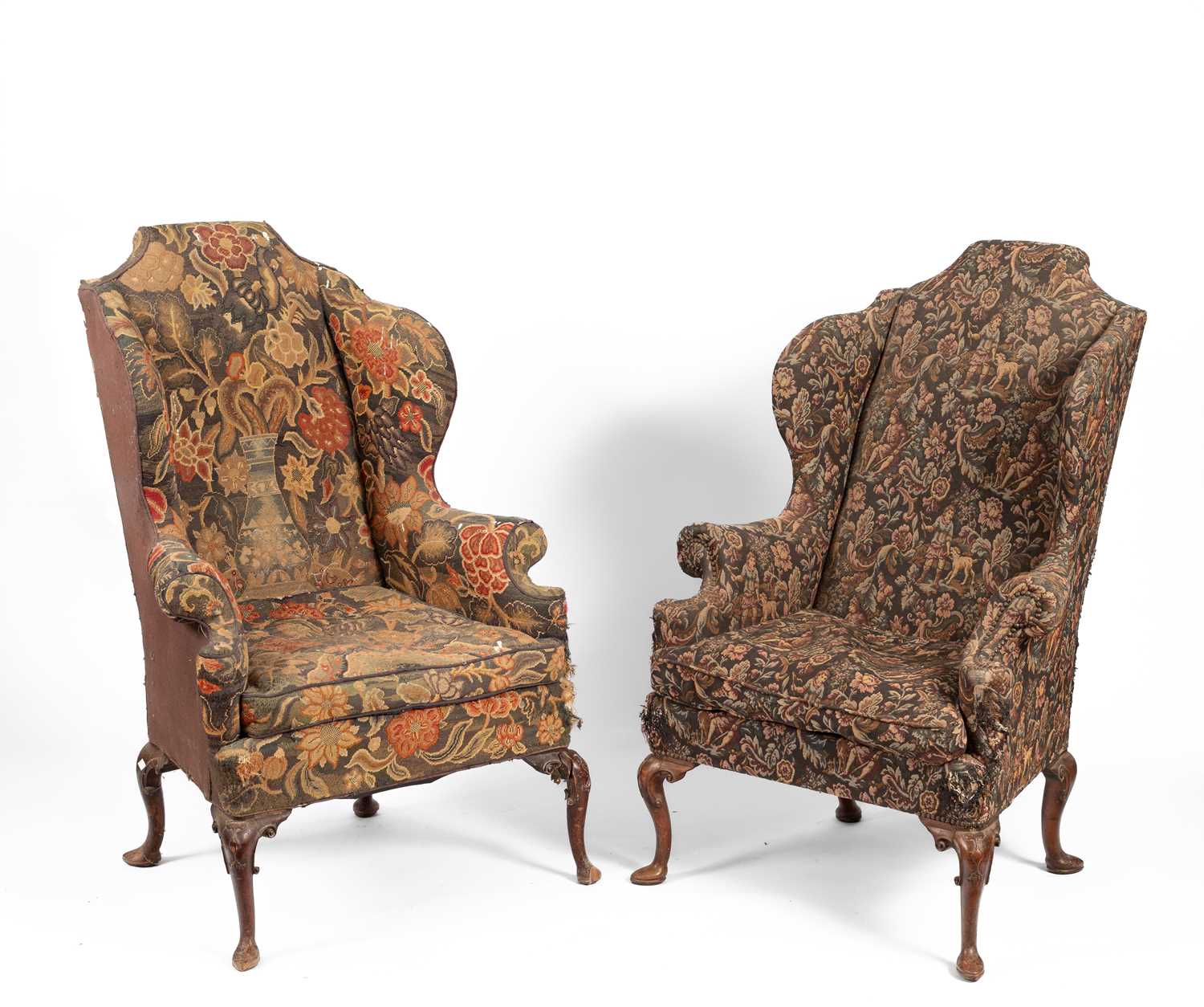 Lot 801 - A pair of upholstered wingback armchairs of Queen Anne design