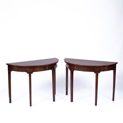 Lot 939 - A pair of George III mahogany demi-lune console tables