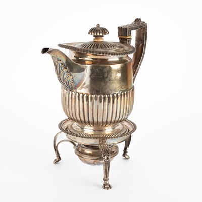 Lot 120 - A George III silver hot water jug and stand