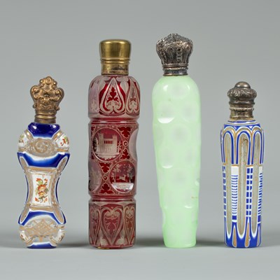 Lot 394 - Four cut and overlaid/stained scent bottles