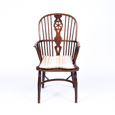 Lot 859 - A yew wood and elm wheelback Windsor chair