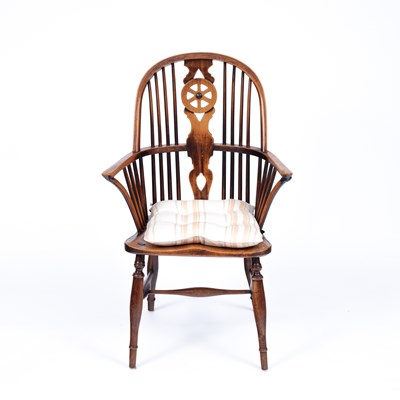 Lot 860 - A beechwood and fruitwood wheelback Windsor chair