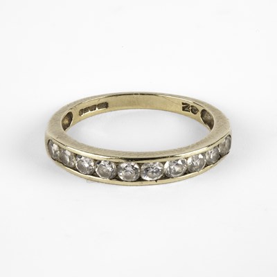 Lot 240 - A 9ct gold and CZ eternity ring