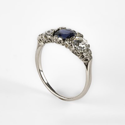 Lot 242 - An 18ct gold, platinum, sapphire and diamond ring