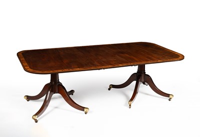 Lot 799 - A Regency style mahogany and yew wood crossbanded dining table